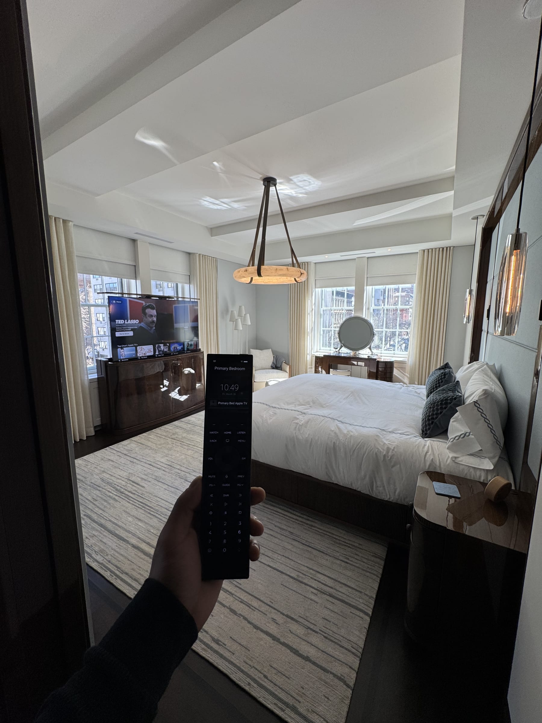 Integrated smart home control in a Manhattan primary bedroom designed by Home Technology Experts