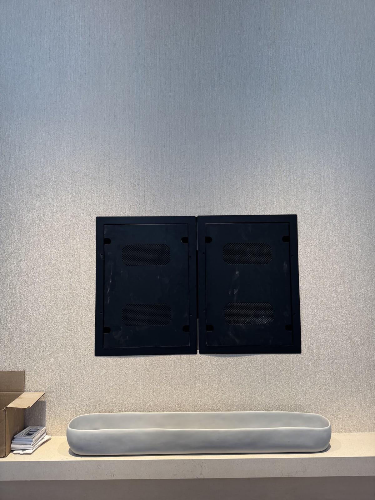 Discreet recessed equipment cabinet integrated into a finished interior