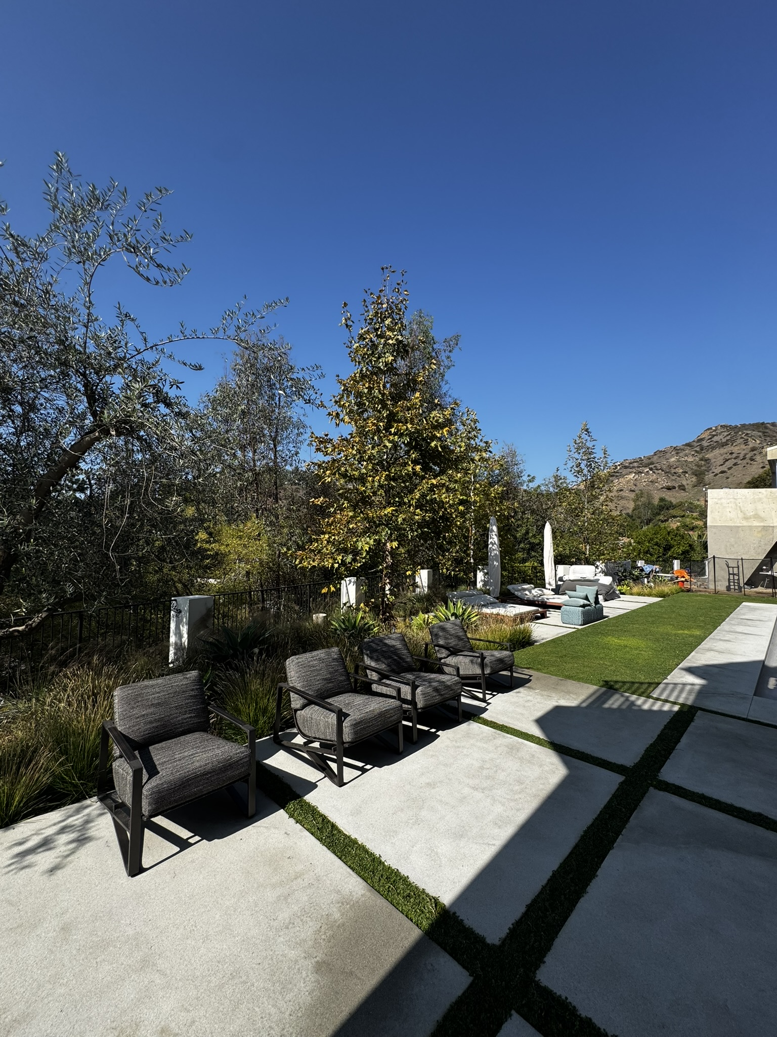 Outdoor rooms with refined Hamptons landscape lighting for evening use and entertaining
