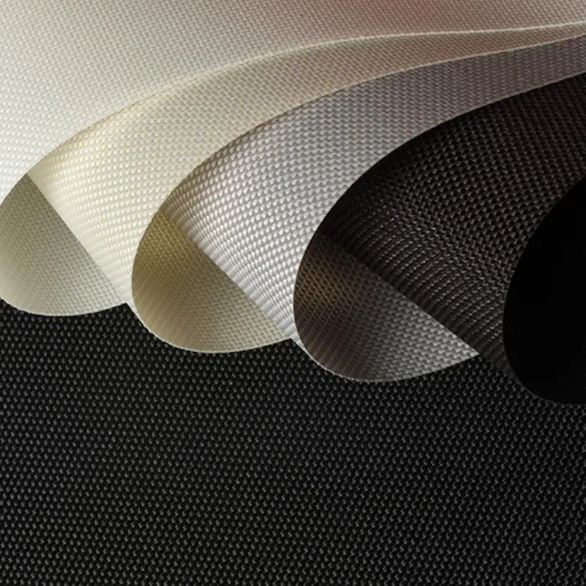 Close-up of layered custom drapery fabrics in neutral and dark tones
