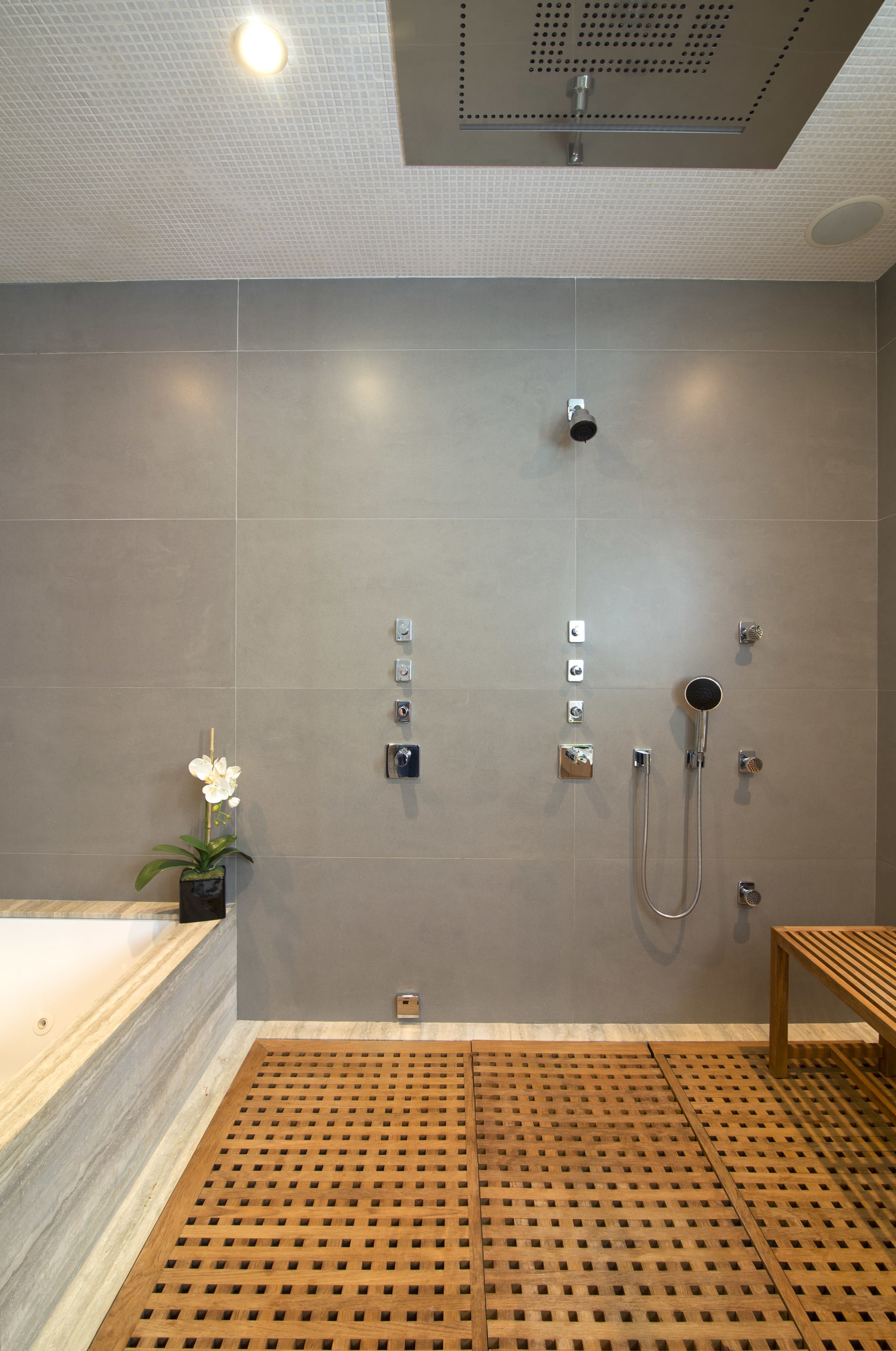 HTE shower speaker installation — integrated audio throughout Hamptons residence