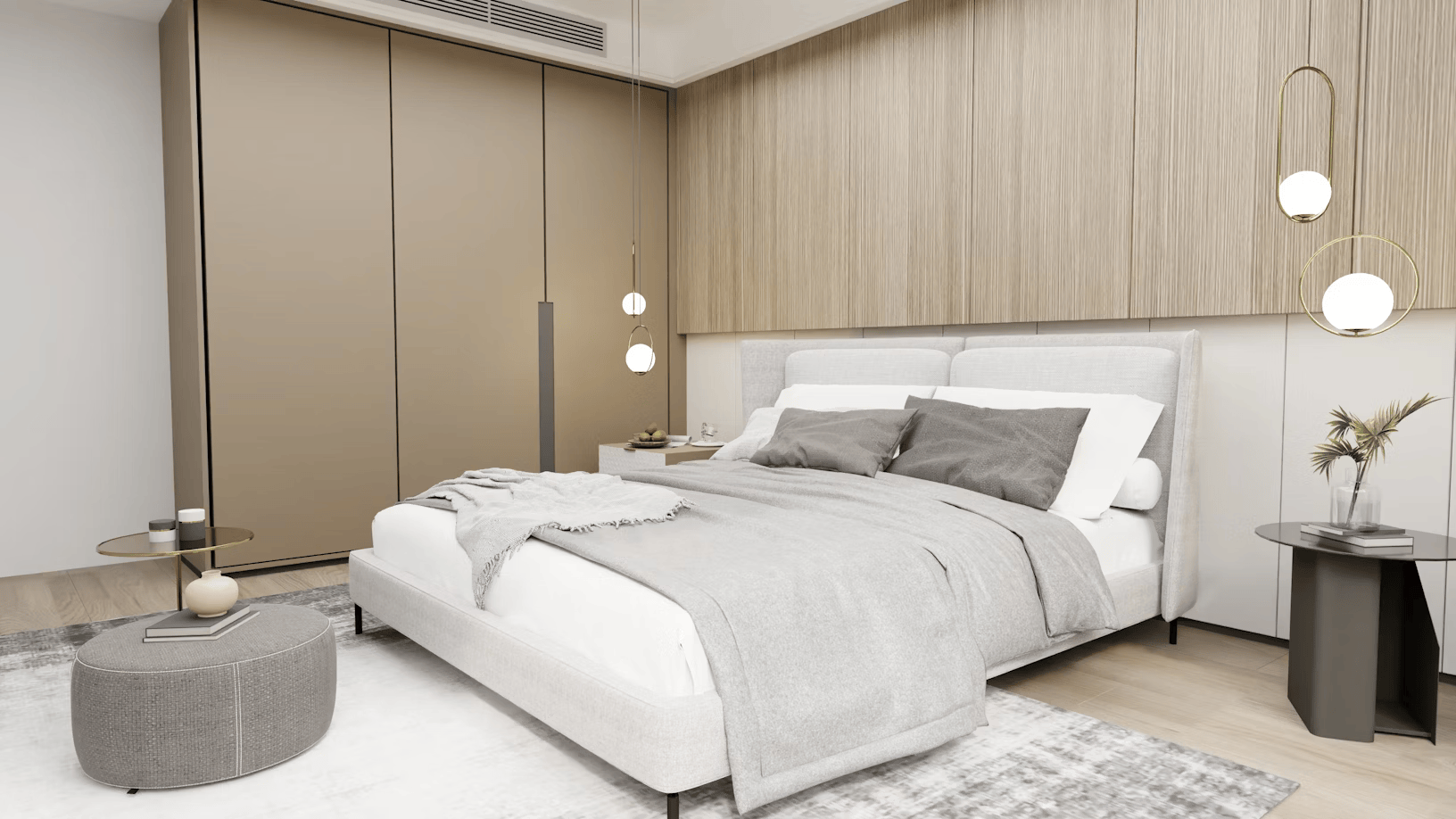 A modern bedroom showcases impeccable interior design with a large bed in gray and white linens. Two dark side tables display decorative items under hanging pendant lights. A spacious wardrobe with brown doors and wood paneling on the wall completes the stylish home space.