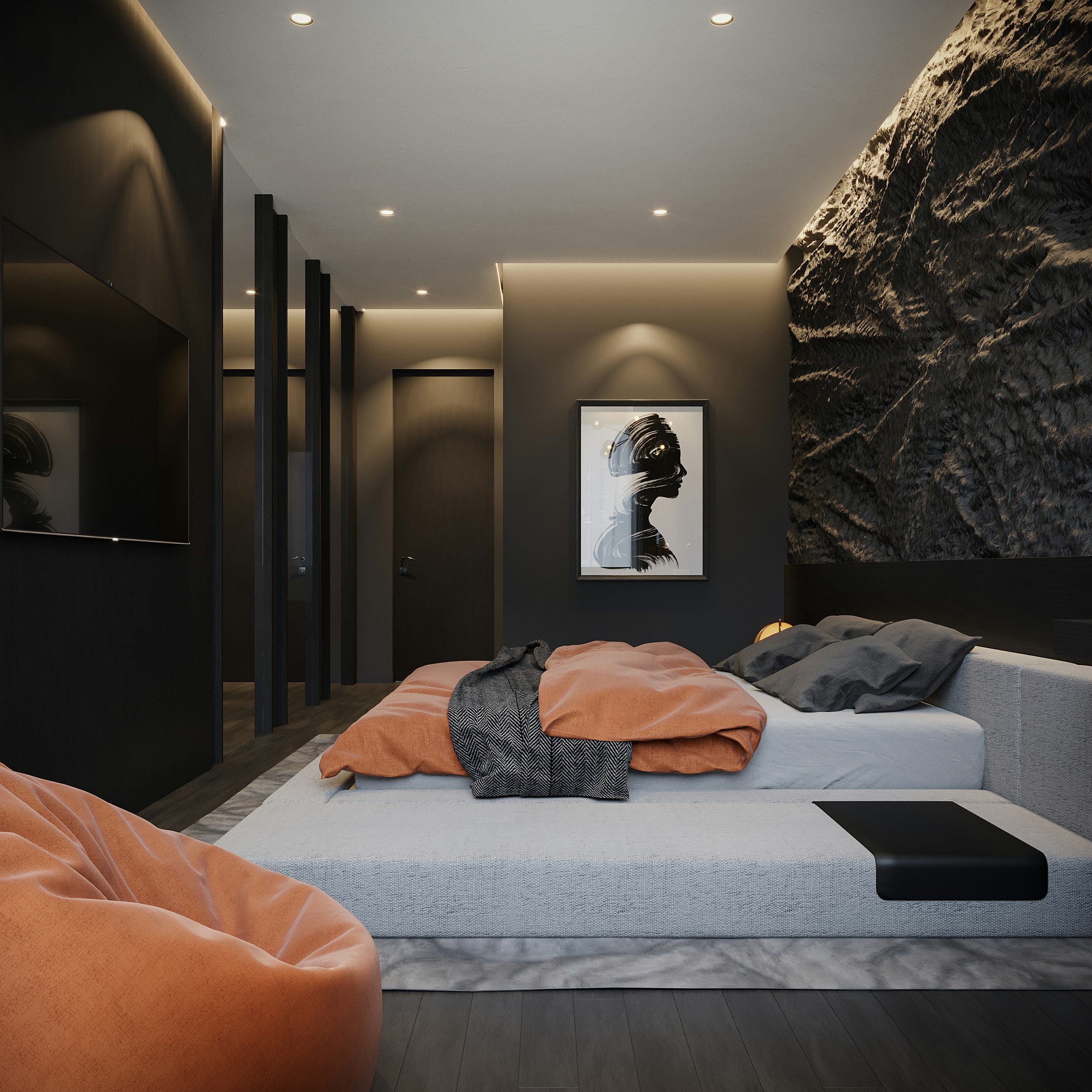 Modern bedroom with a minimalist design, skillfully melding interior design elements. Features a low platform bed with orange bedding and a gray blanket. A textured black wall, recessed lighting, a portrait on the wall, and a soft chair in the foreground complete this refined home space.