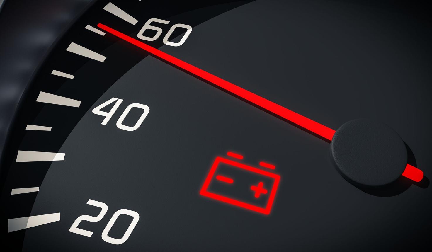 Battery warning light illuminated on a car dashboard
