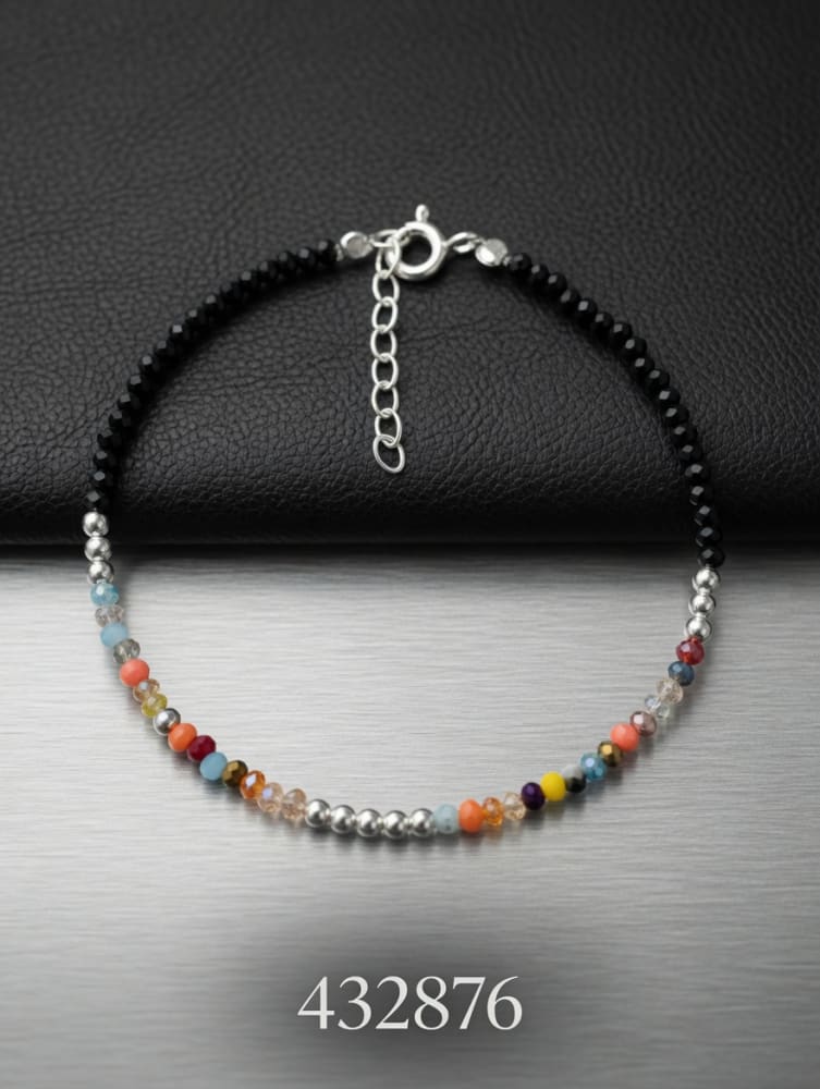PULSERA CON CRISTALES NEGROS Y COLORES PLAT. IMPORTANTE