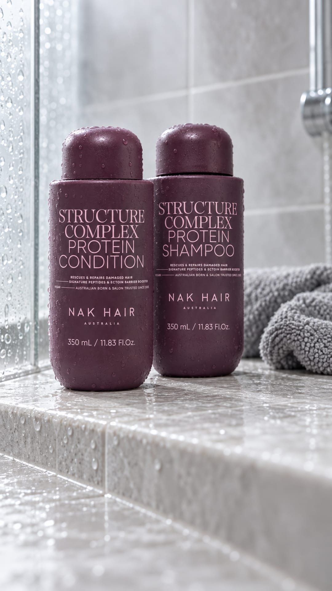 Structure Complex Protein Shampoo and Conditioner on a tiled shower ledge.