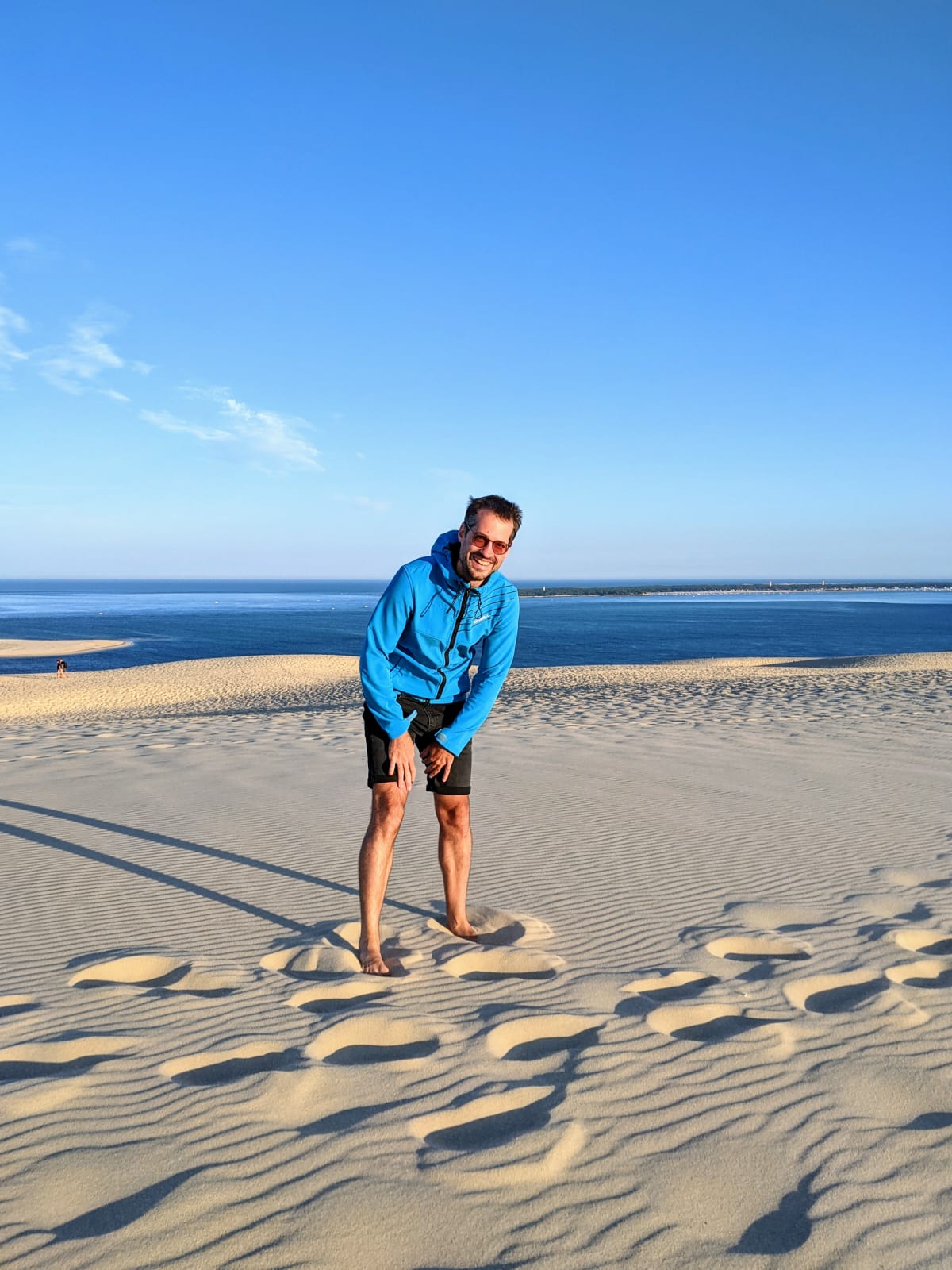 Fred doing (laughing) yoga on the dune.