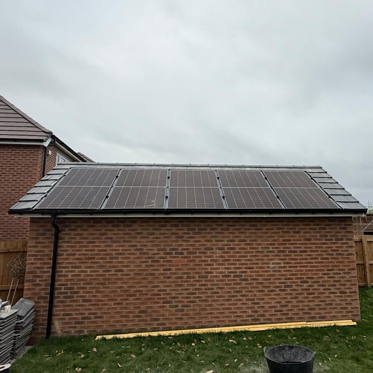 Solar panel installation Eccleston garage roof with GSE in-roof system powering air source heat pump