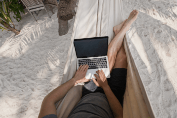 Person on a hammock with a laptop