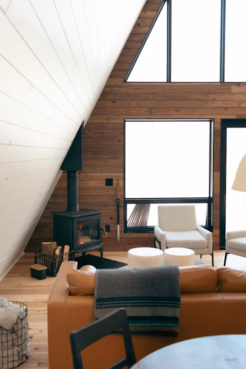 Open concept living room featuring custom walnut shelving