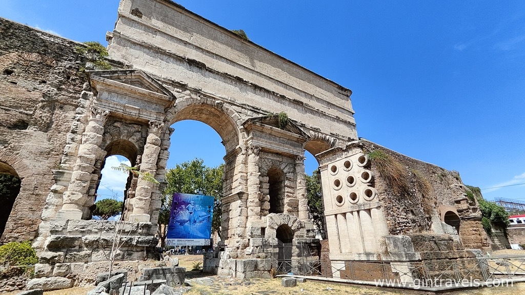 Porta Magiore with Tomb of Eurysaces (9 holes on the right), Rome