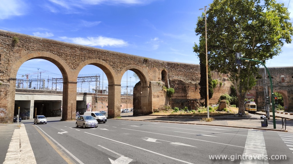 Porta Magiore with paved roads and tram on the righ side, Rome
