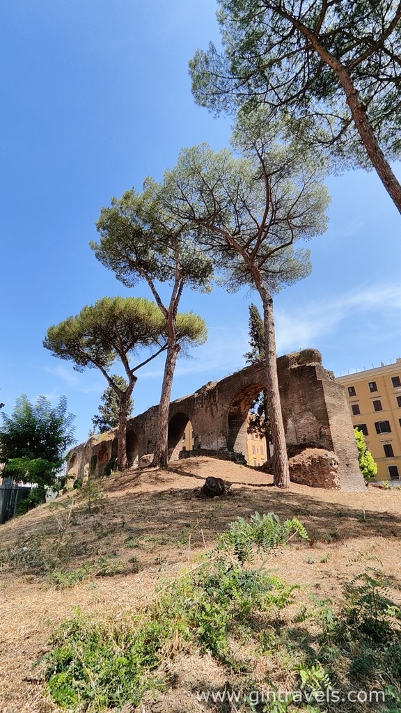 Hill with trees and aqueduct ruins