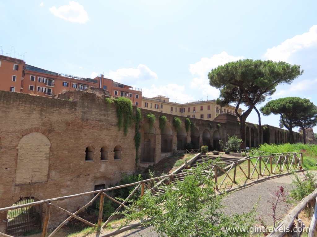 Aurelian Walls with a backdrop of modern houses and green park