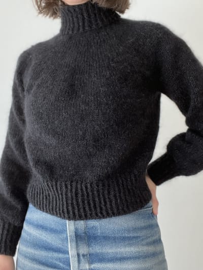 The finished sweater being worn before blocking