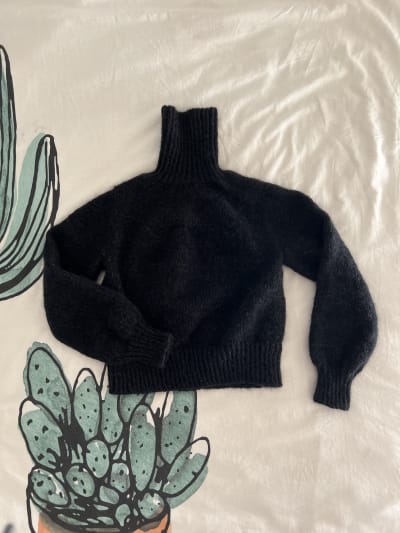 Flatlay view of the finished sweater