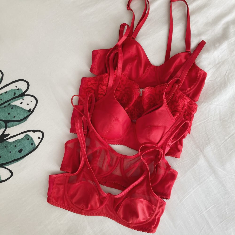 A collection of red Maya bras