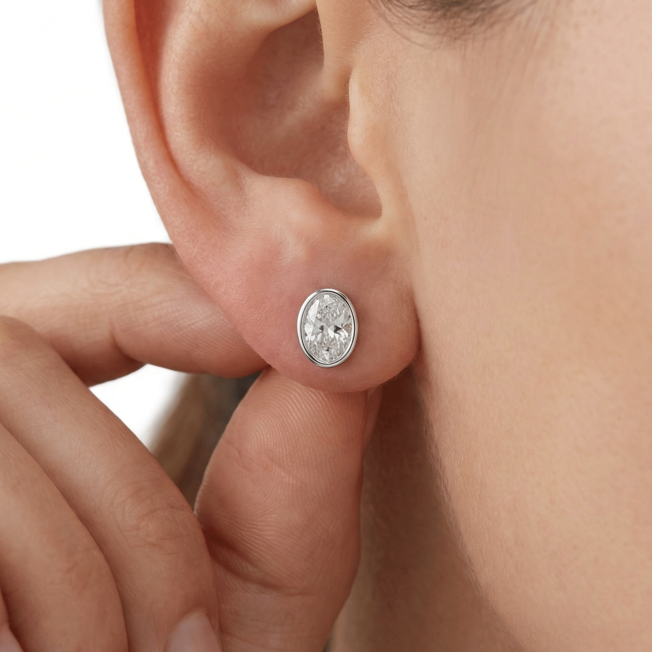 Valencia bezel oval diamond stud earrings in white gold — earth and grown diamonds by Amber Arc – view 4