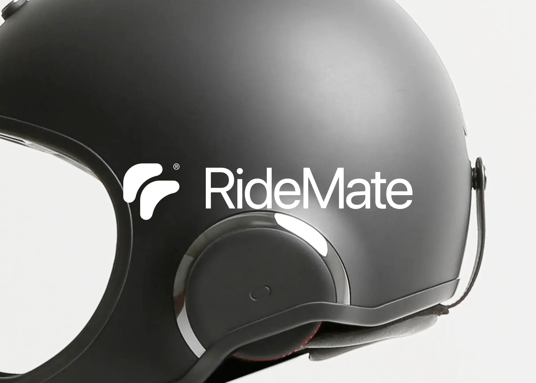 Motorcycle helmet with RideMate text, linking the startup to vehicles.