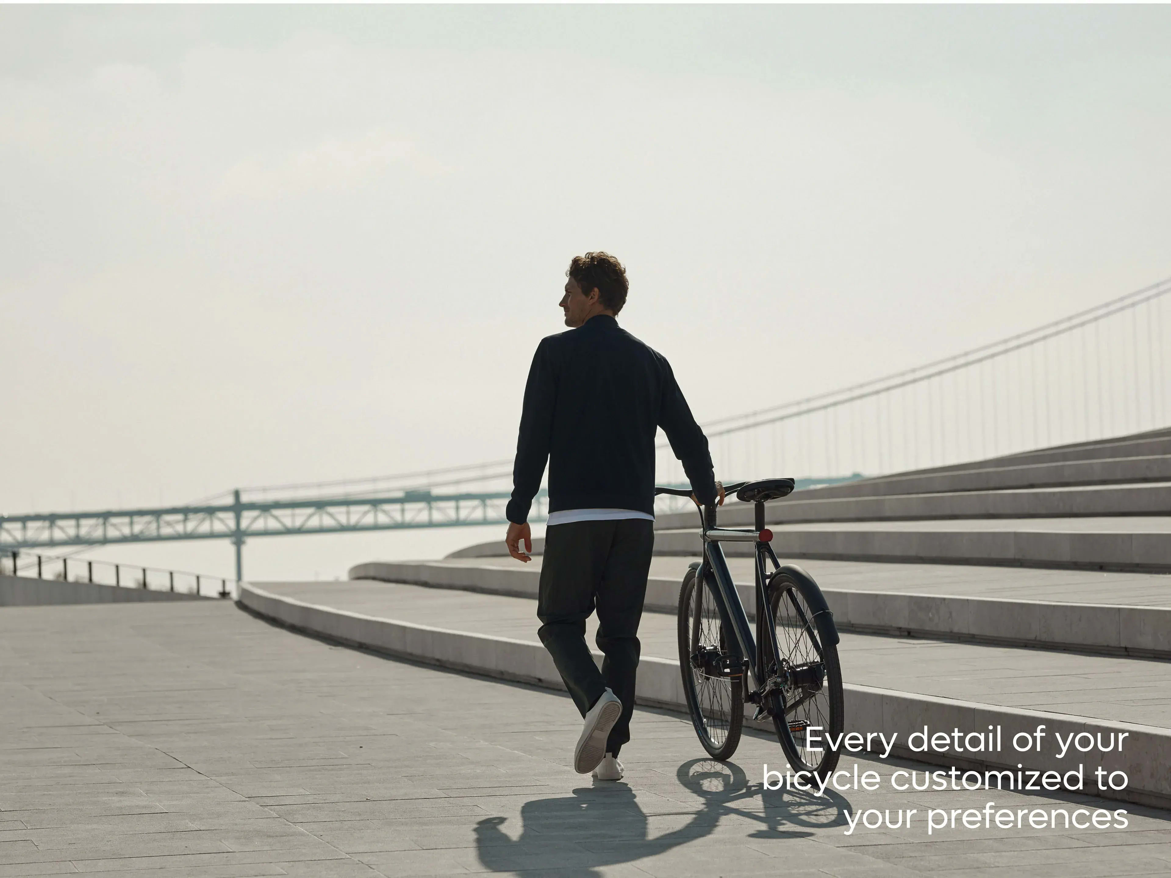 VanMoof S3 e-bike with a person and text "Every detail of your bicycle customized to your preferences," highlighting app features.