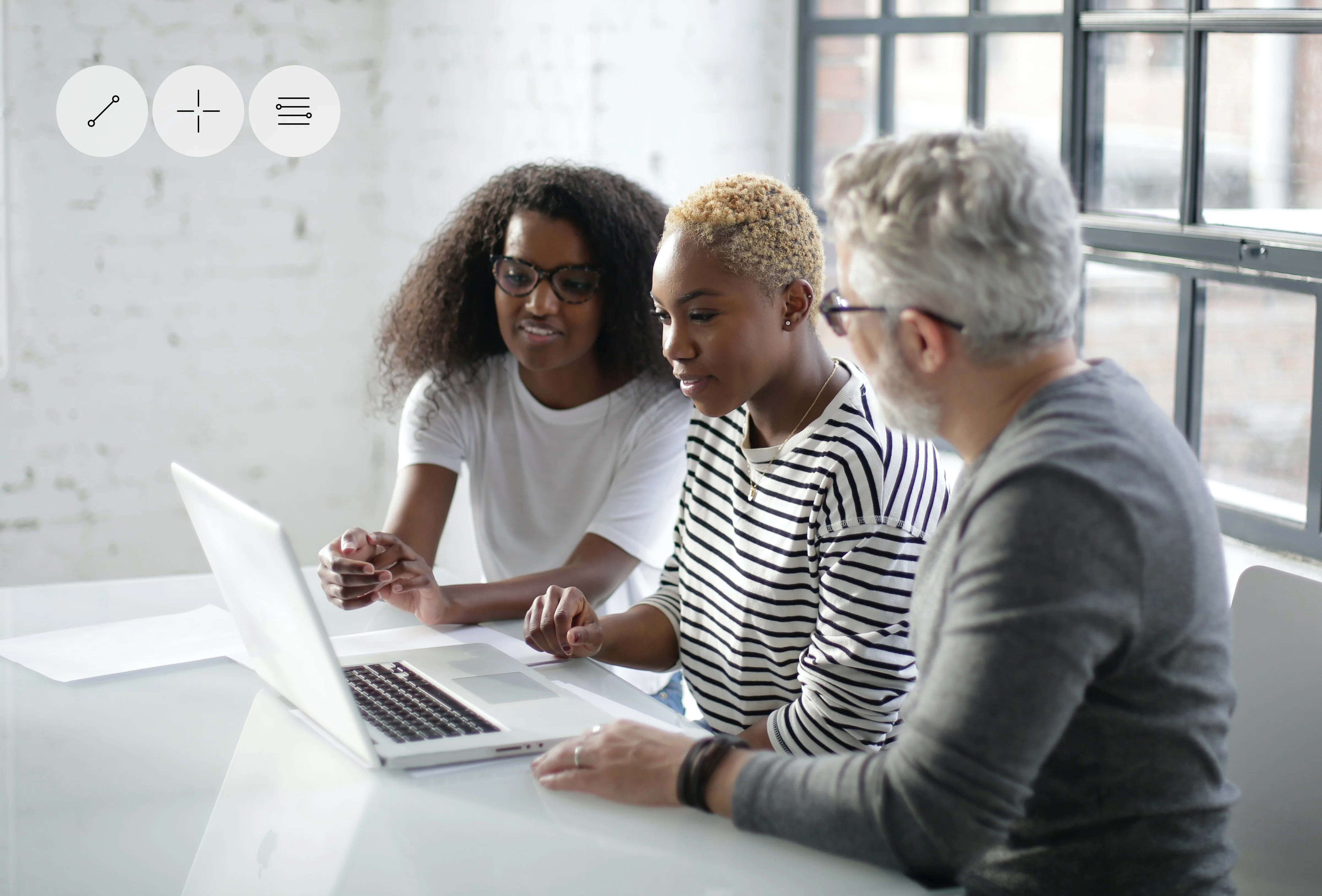 Coaching session using a laptop, related to software training or product design.
