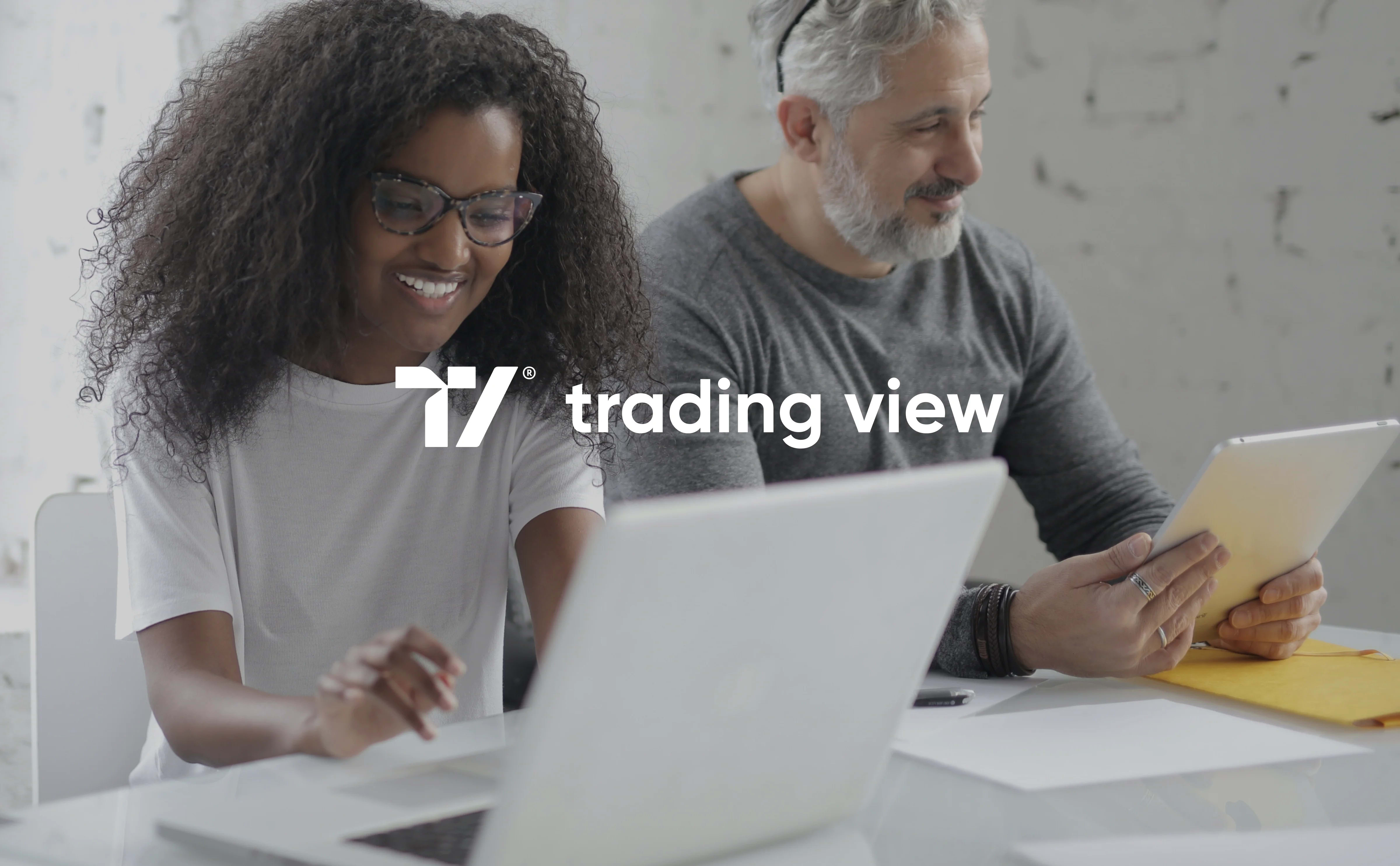 Professional using the TradingView platform on a laptop, relevant to the product design case study.