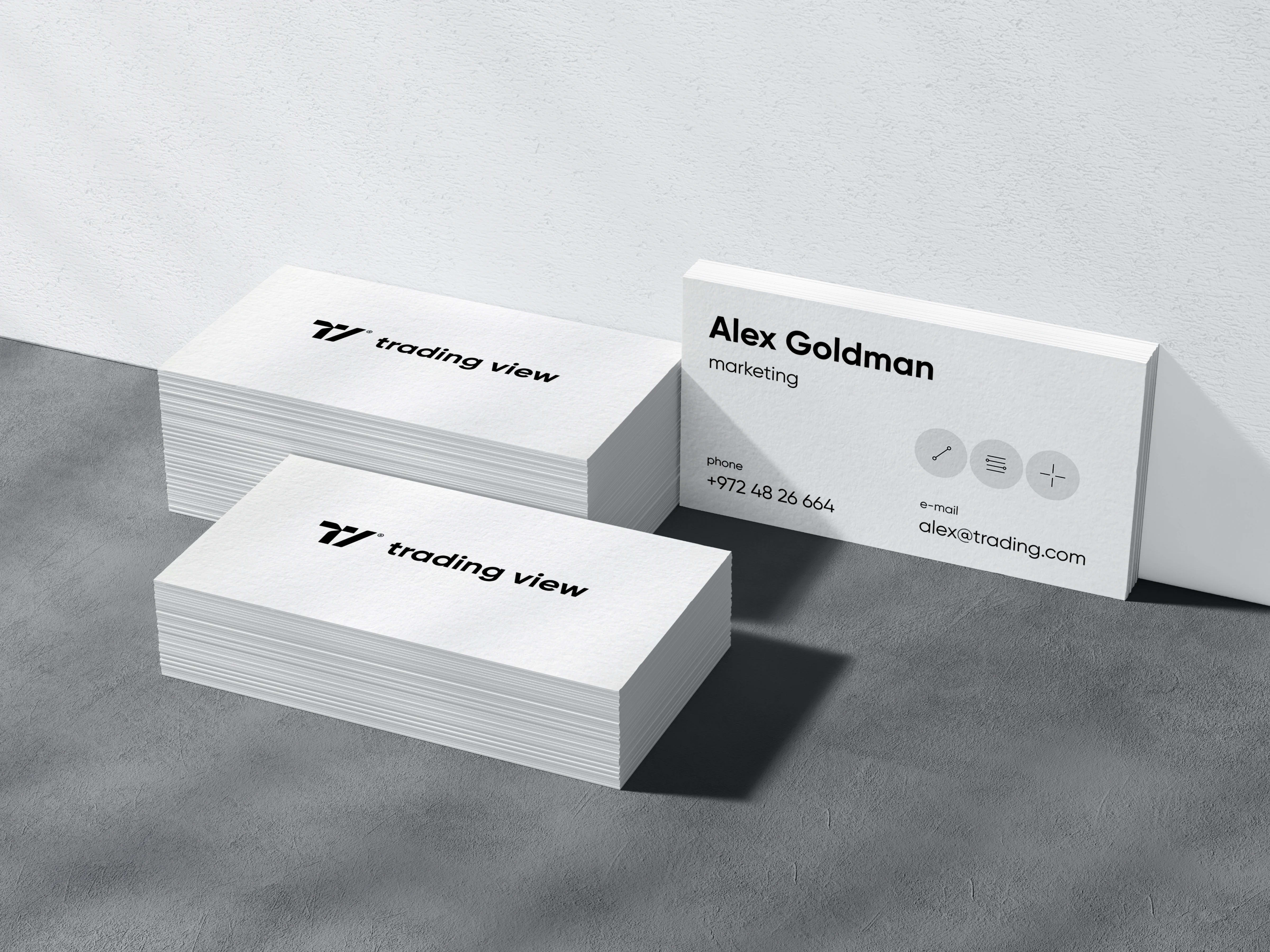 A stationery design mockup featuring a business card for TradingView's Alex Goldman.