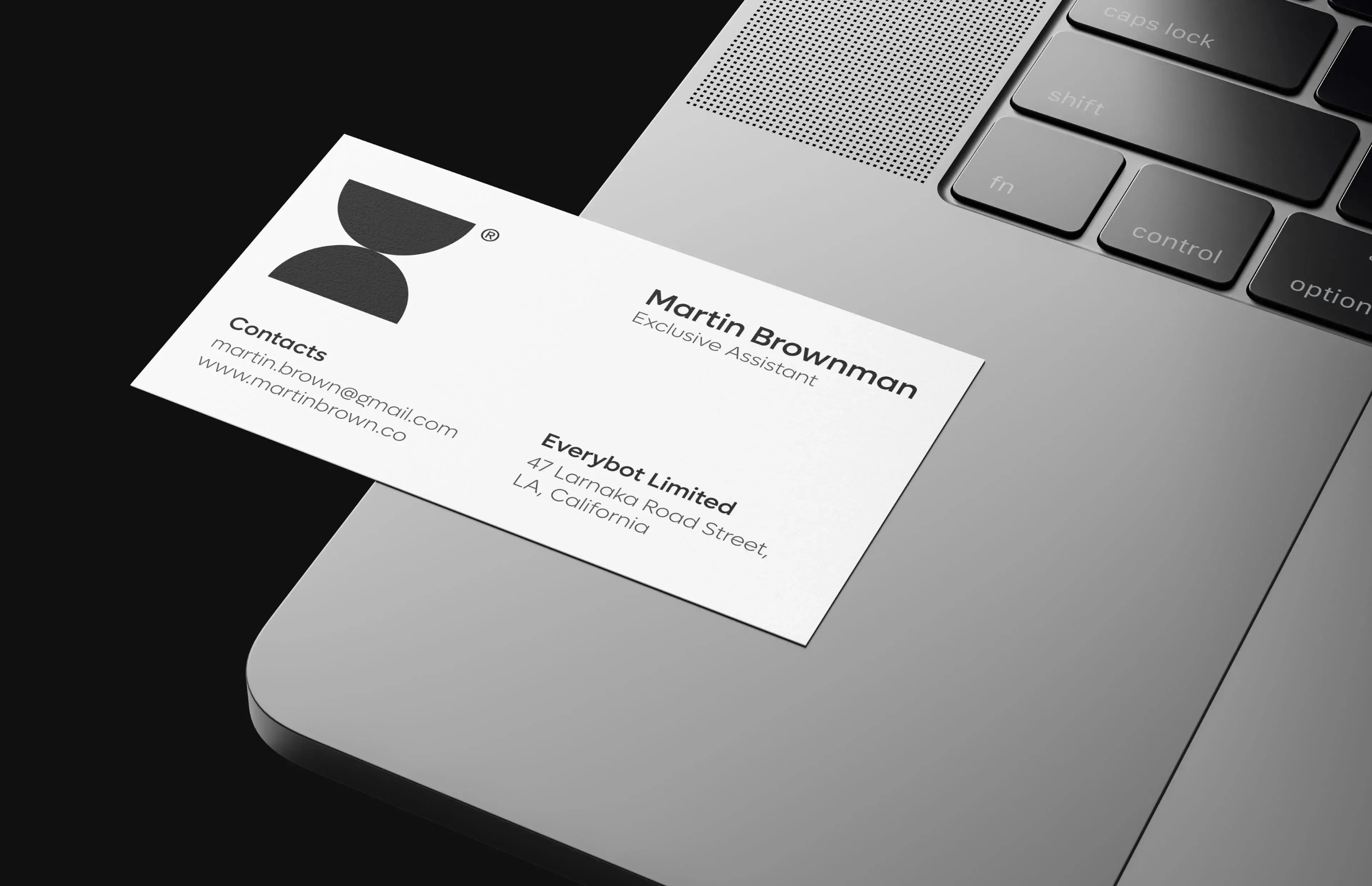 Printed business card or document with silver text, representing a startup mobile app business.