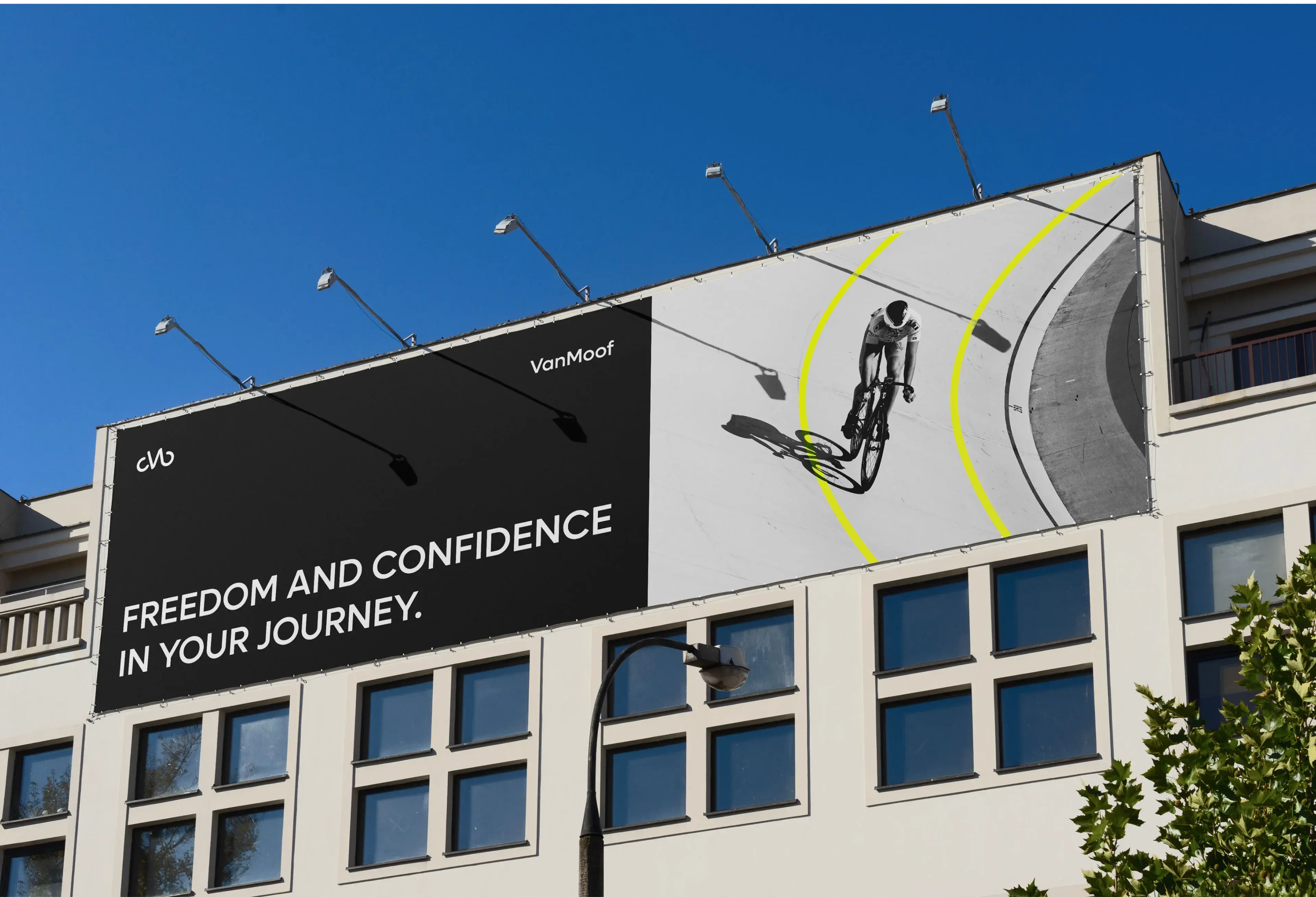 Billboard mockup showing VanMoof branding and the slogan "Freedom and confidence in your journey".