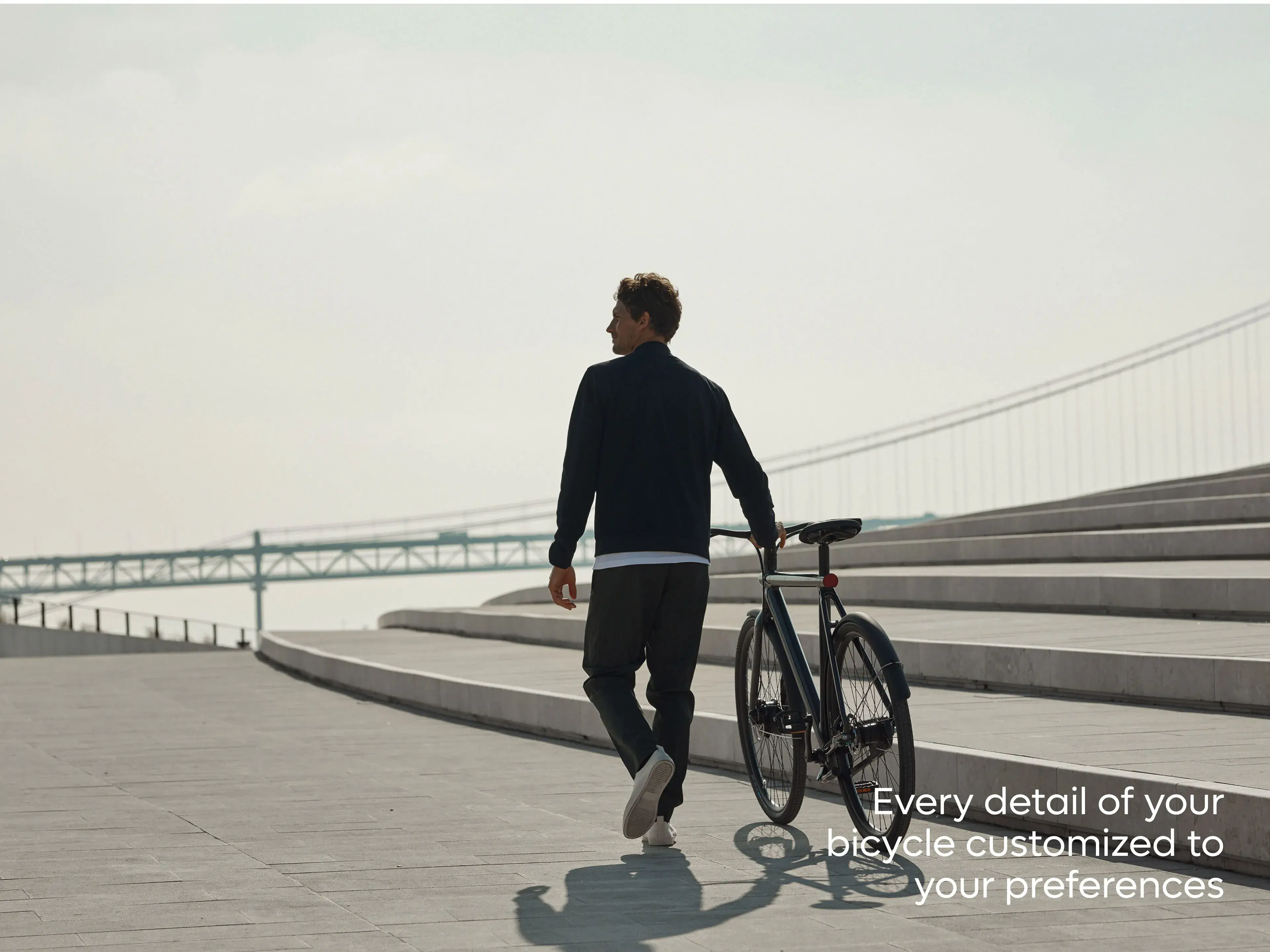 VanMoof S3 e-bike with a person and text "Every detail of your bicycle customized to your preferences," highlighting app features.