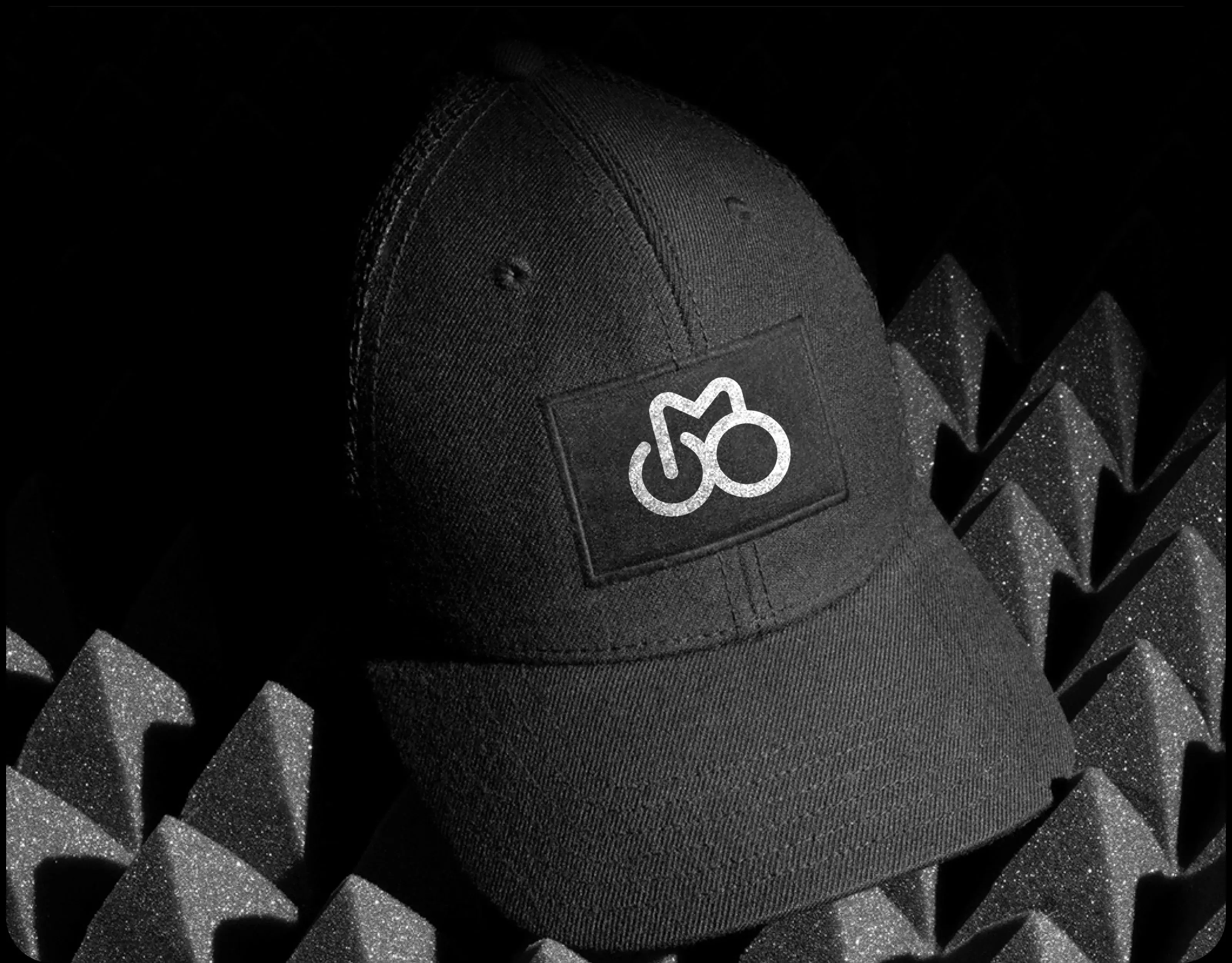 Design mockup of a black baseball cap, illustrating potential branding for a sport or wellness app.