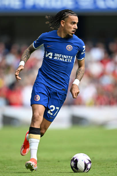 Malo gusto with the number 27 jersey
