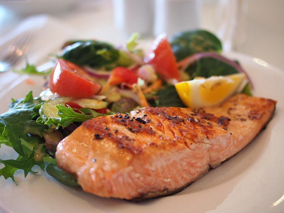 Oven-roasted salmon topped with fresh herbs and lemon butter. Served with garlic mash and green beans.