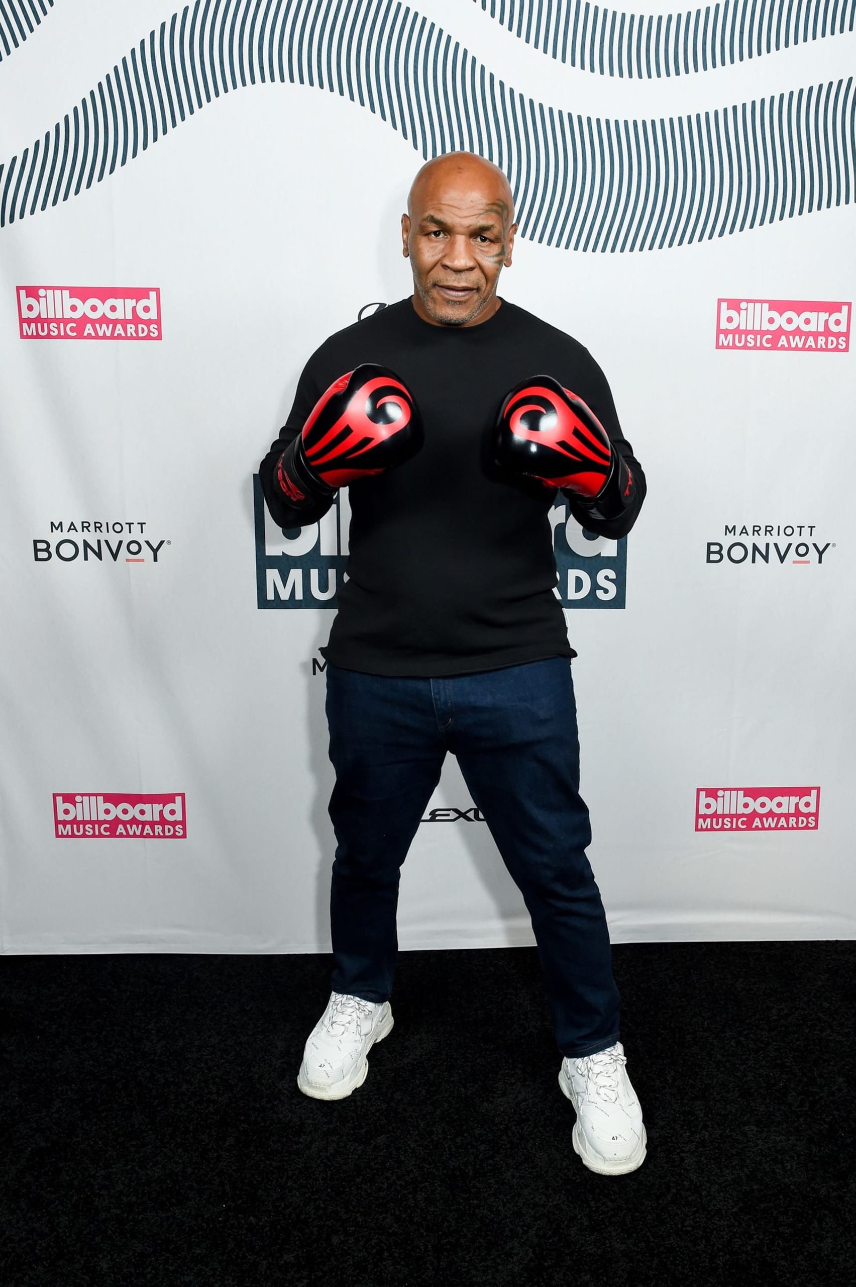 Boxer Mike Tyson accessorized his casual look with a pair of red 262488392