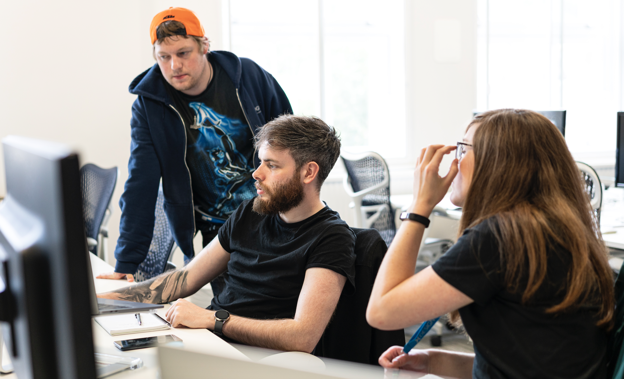 Software developers looking over code