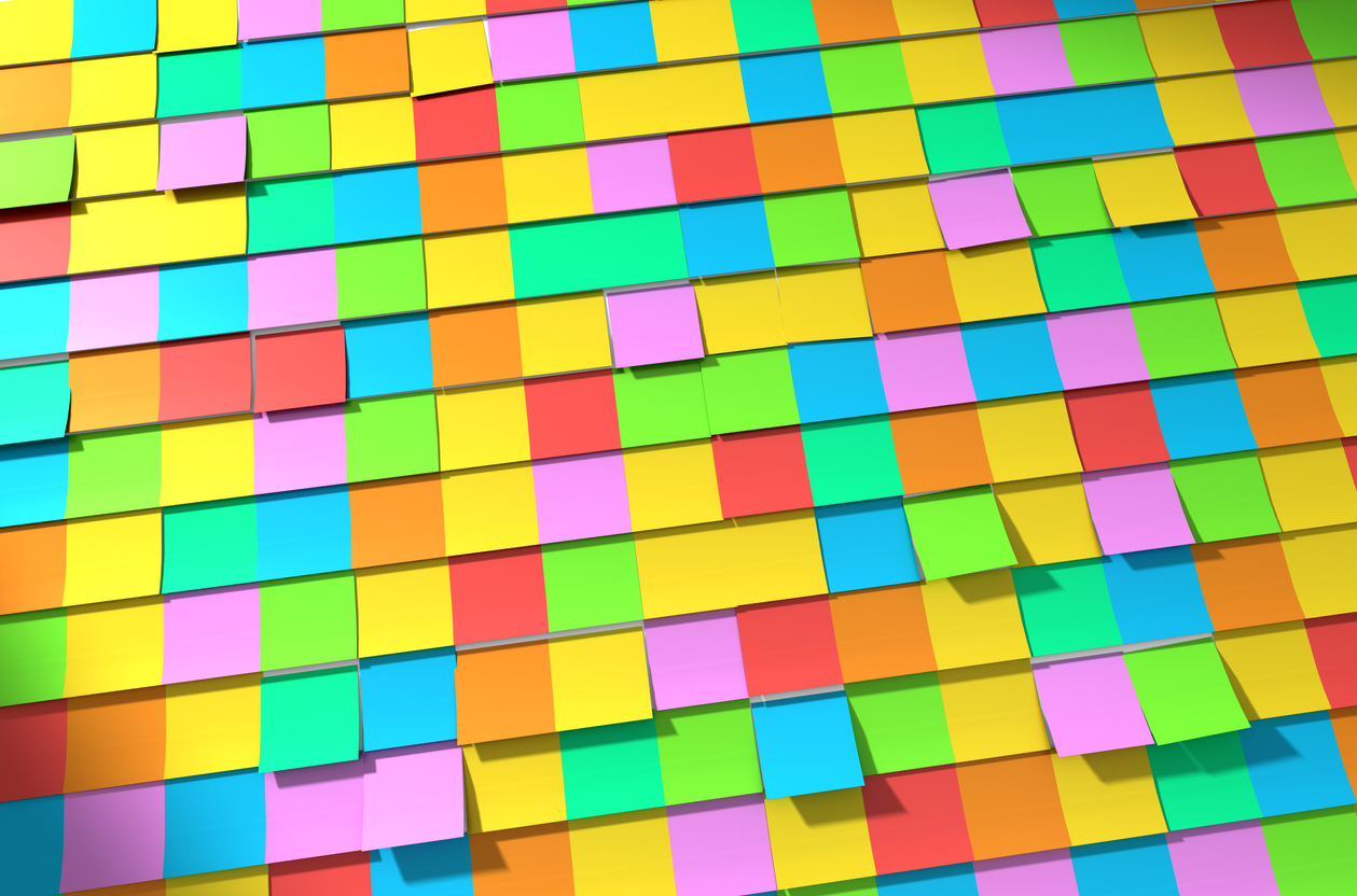 Wall of sticky coloured post it notes