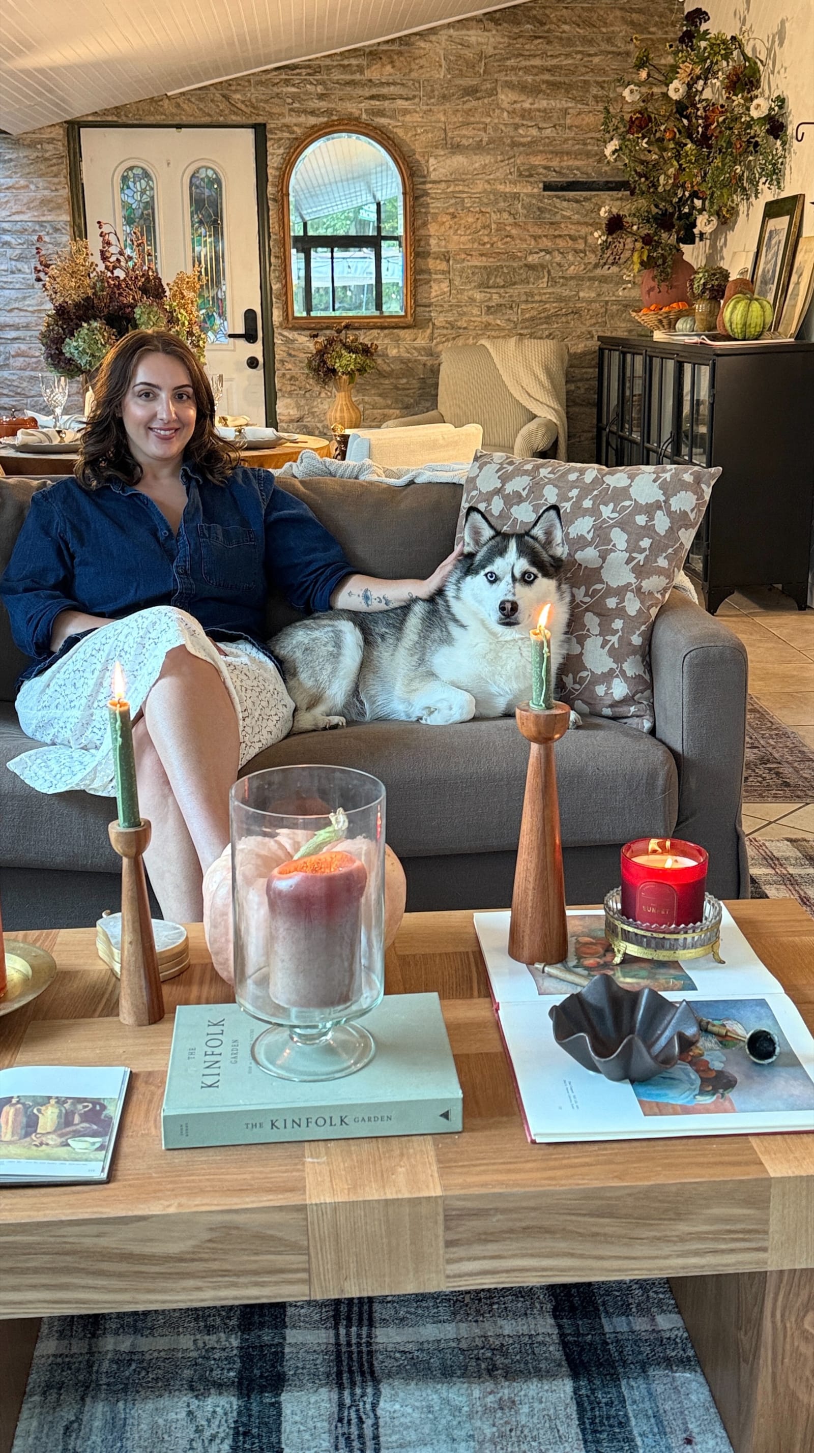 Medina Colaku at home in her fall living room with her husky