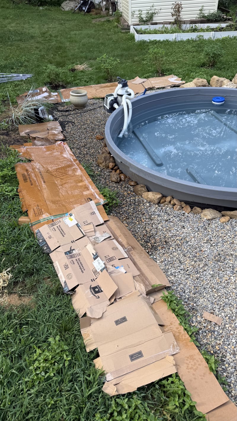 DIY stock tank soaking pool in a New Jersey backyard