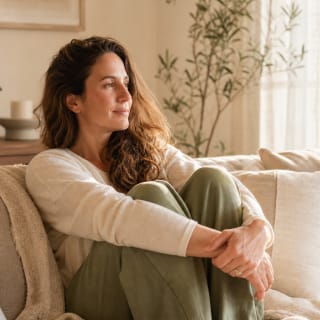 Woman finding calm and safety during trauma recovery through online therapy