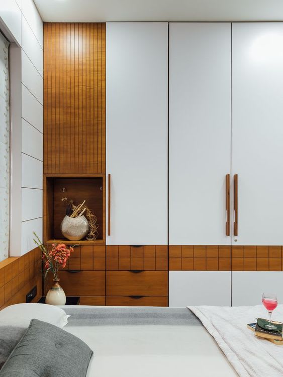 Wardrobe with multiple storage sections and drawers