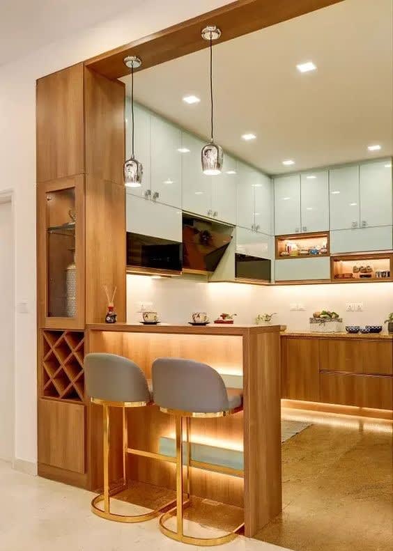 Dining space with marble table and warm ceiling lighting