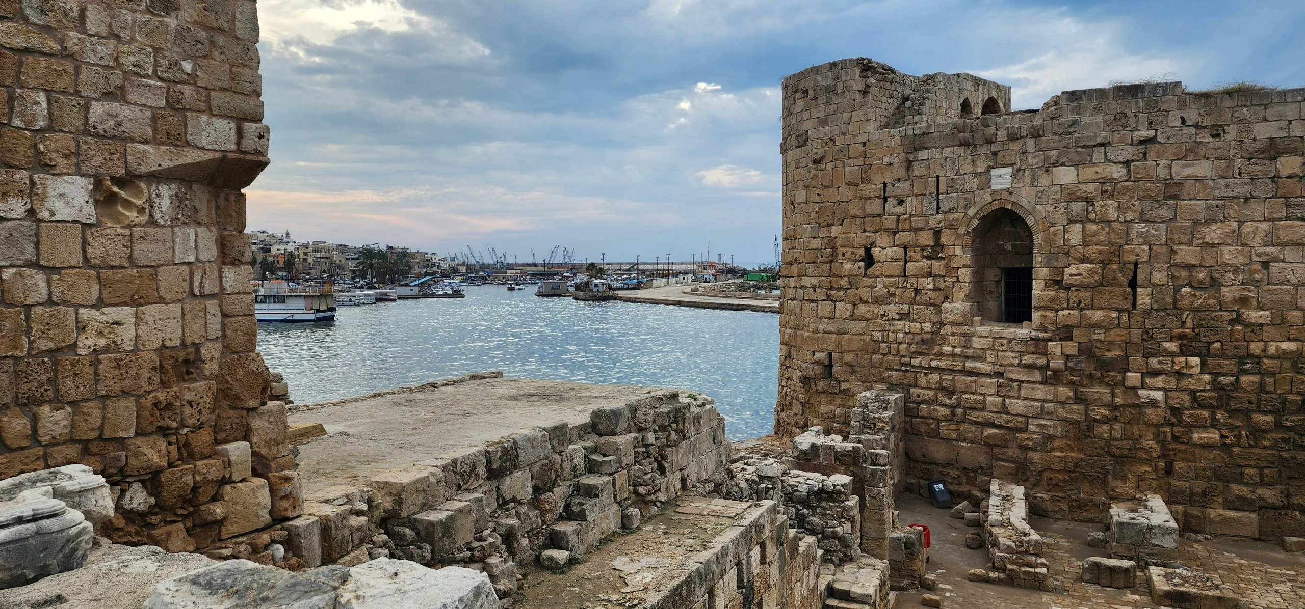 Sidon Sea Castle with sea water under a cloudy sky.