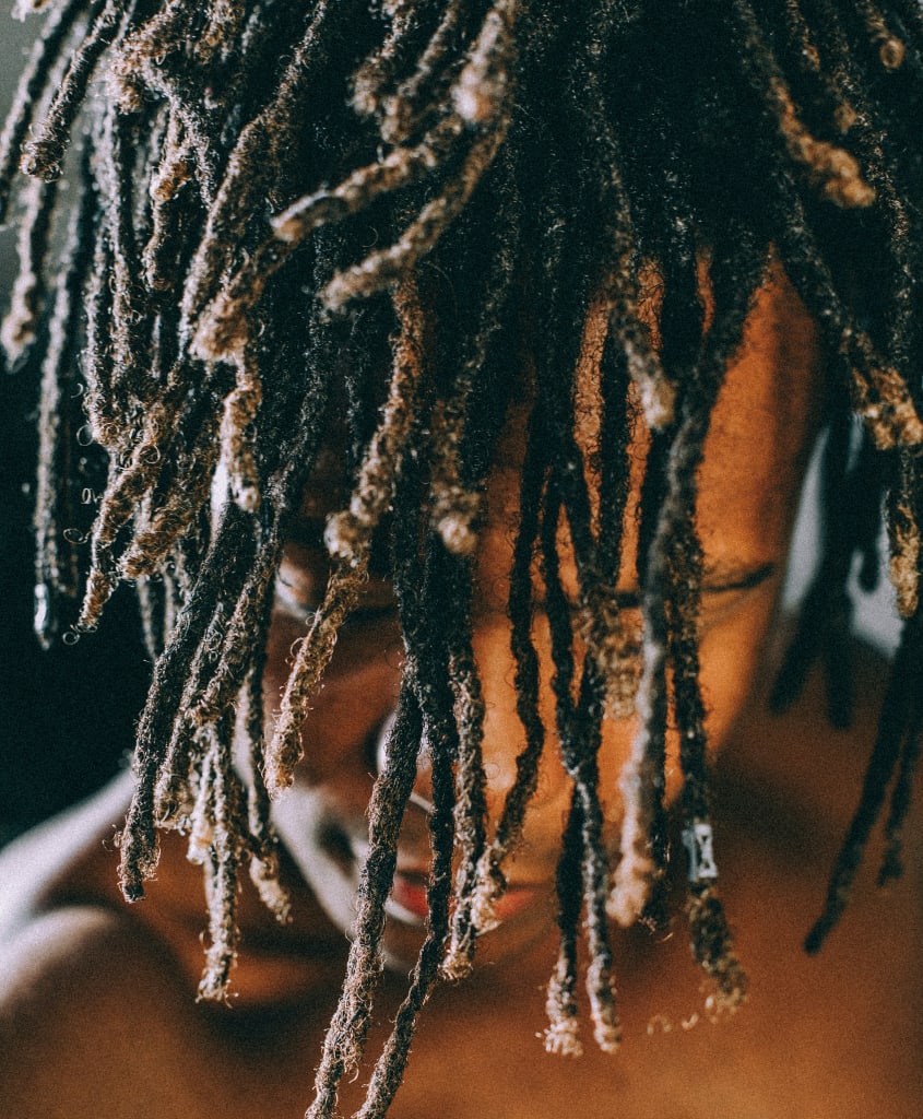 Closeup photography of man with dreadlock hair