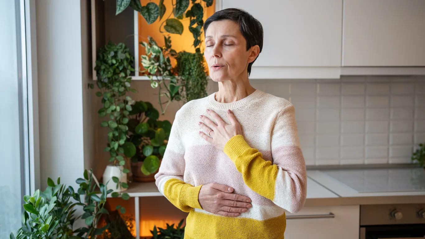 Practice diaphragmatic breathing by placing a hand on your belly and feeling it rise and fall