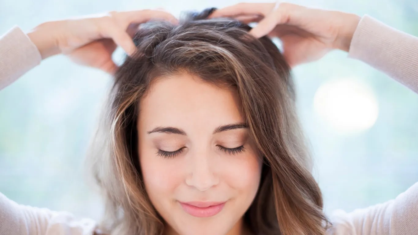 Massage the base of your skull with your fingertips