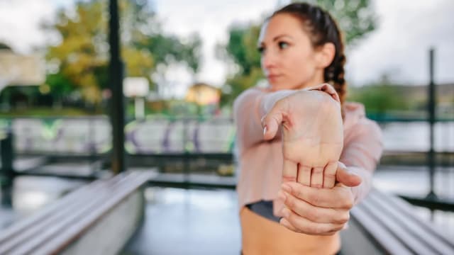 Do a 1-minute wrist stretch