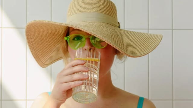 Pour yourself a glass of water and add a slice of lemon