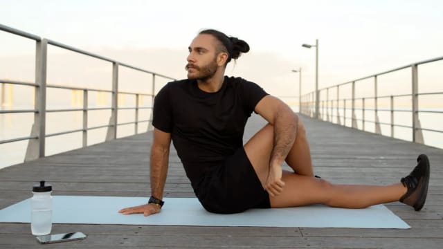 Do a seated spinal twist for 30 seconds each side
