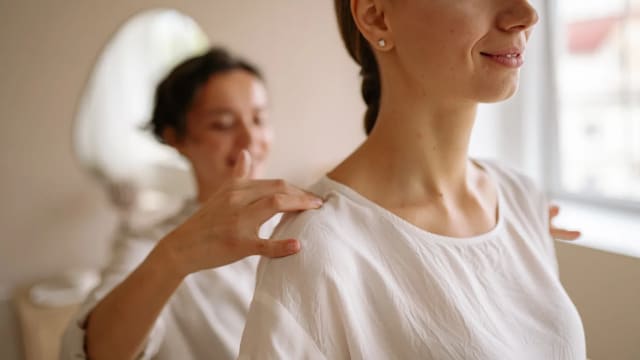 Do a 1-minute shoulder roll exercise