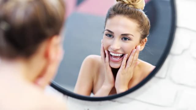 Smile at yourself in the mirror